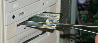 photo courtesy of CNET Japan credit cards in floppy drive